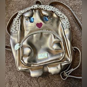 Betsy Johnson metallic Kitten mini backpack with matching clutch. Never used!